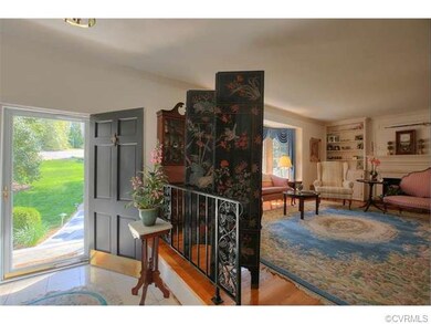 THE FOYER HAS A  LOVELY MARBLE FLOOR. AND LEADS TO