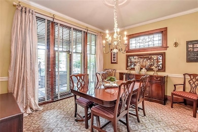 Floor to ceiling windows in the dining room open t