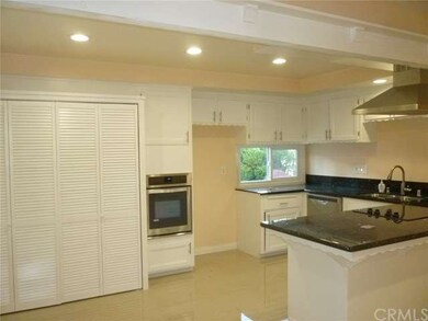 Spacious open kitchen with new tile flooring, gran