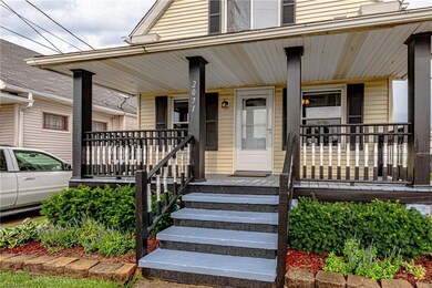 View of exterior entry with a porch