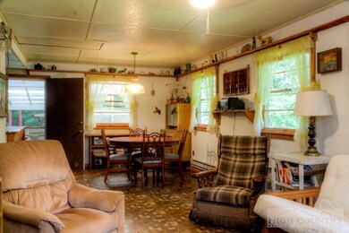 The Living Room: The living room and dining room is open to the kitchen.  It's a bright area with tons of light streaming in through the ample windows.