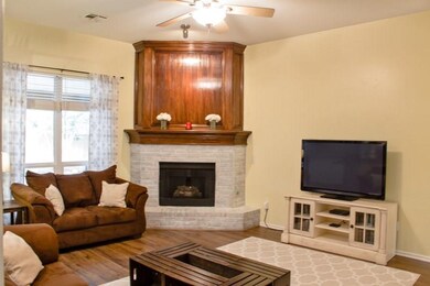 Living room with new wood look flooring and fresh 