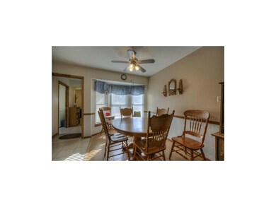 Dining area is highlighted with chair rail and bay