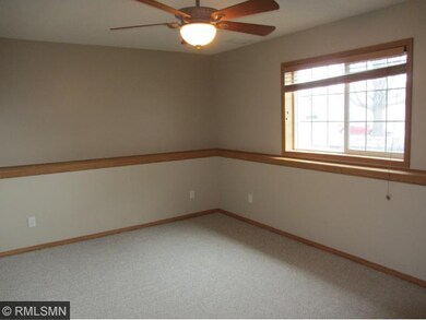 Lower level bedroom has lookout windows that let i