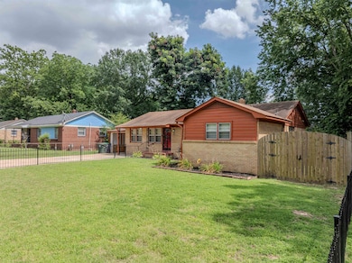 Ranch-style home with brick siding and a gate
