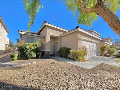 View of front of house with stucco siding, a garag