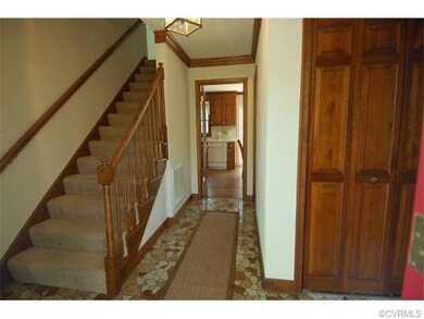 Welcoming front foyer.  Gleaming rich wood (not th