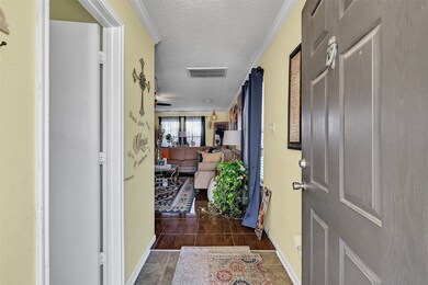 Entryway and half bath to the left.