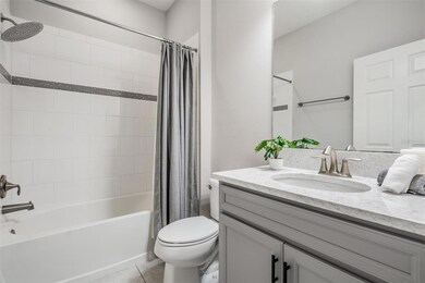 Hall bathroom next to downstairs secondary bedroom
