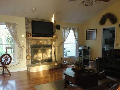 Living Room. The living room features a wood -burn