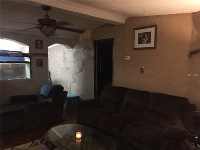 Large livingroom area. The archway was built going back to a small office with wall created to hold the 100 gallon fish tank that is also included. The office also has a window to front of home. Office is currently being used for storage. Tenant had 