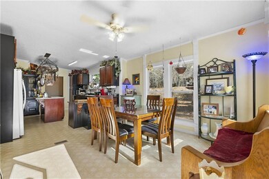 Dining space with visible vents, a ceiling fan, or