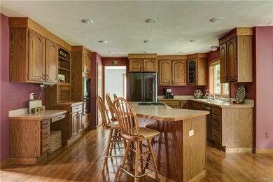 Beautiful hardwood floors continue into kitchen.