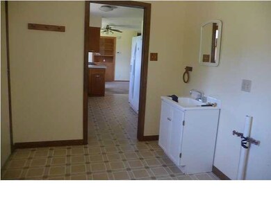 mud room is located off the kitchen and has a door