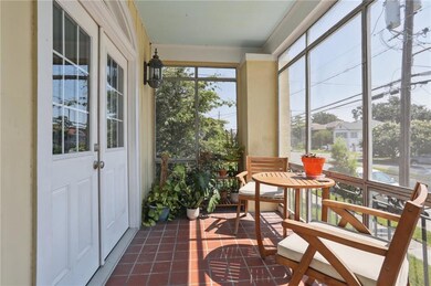 Screened front porch made for sipping iced tea in the afternoon