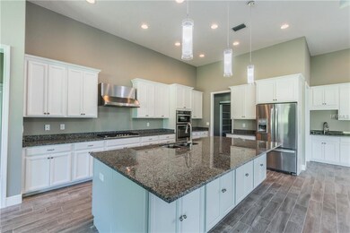 Kitchen with built-in gas range, stove, microwave 