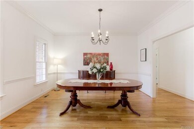 Formal Dining Room with same hardwood floors, crow
