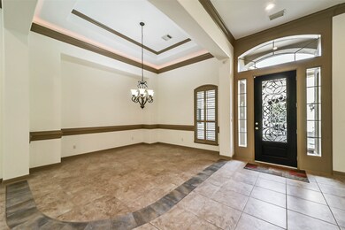 Formal dining room with crown molding and cove lig