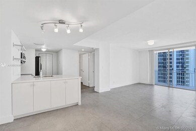 Open white contemporary kitchen with washer and dr