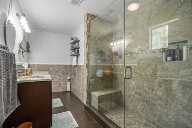 Primary Ensuite With Dual Sinks & An Oversized Tiled Shower