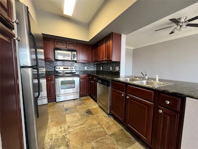 The spacious kitchen also has a breakfast bar for