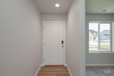 Doorway to outside featuring recessed lighting and wood finished floors