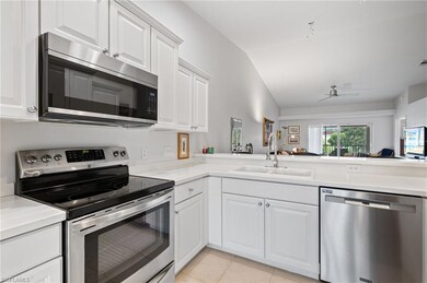Kitchen featuring lofted ceiling, stainless steel 