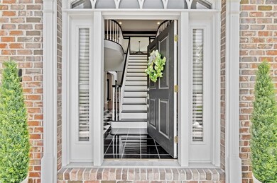 Exotic entry with marble tile, high gloss black fi