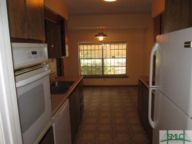 Large Galley Kitchen with Breakfast Area in Back. 