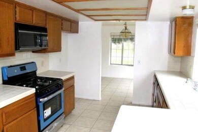 Kitchen with new stove and dishwasher