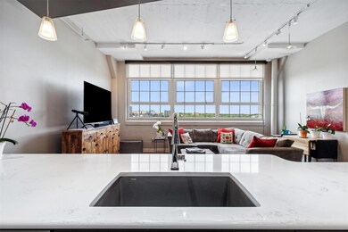 Kitchen featuring hanging light fixtures, rail lig