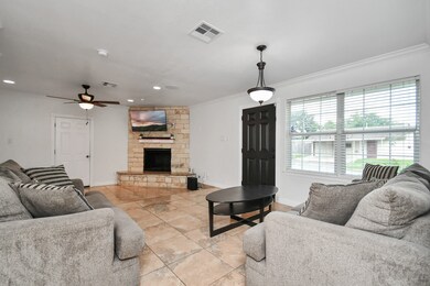 This bonus room features elegant crown molding and tile flooring. Relax and stay warm by the stone fireplace, while enjoying the built-in surround sound system for your movie night or the big game!