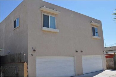 4388 Duplex exterior with attached two car garages