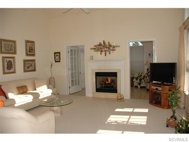 Another view of living room with gas fireplace and