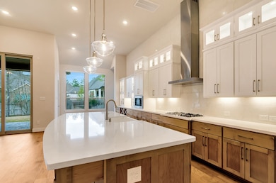 Gas cooktop sits alongside beautiful white quartz