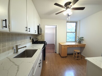 Newly updated kitchen has gas cooking and white cabinets
