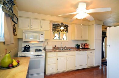 Kitchen includes gas stove, built-in microwave, re