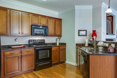 Kitchen offers hardwood, granite, pantry and all appliances remain