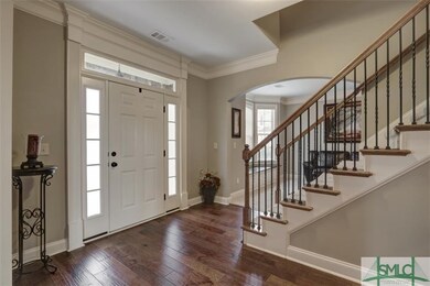 Front entry foyer leading to stairs to second leve