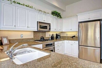 Gourmet kitchen with stainless steel appliances an