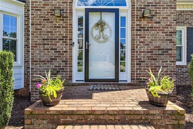 Entrance to property with brick siding