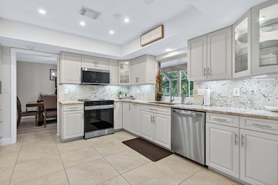 High end Granite counter tops and backsplash and soft close cabinets