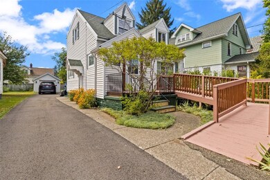 Long driveway leading to 1 car detached garage