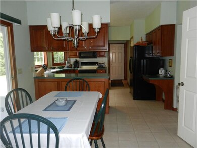 Large eat in kitchen that opens to the enclosed ba