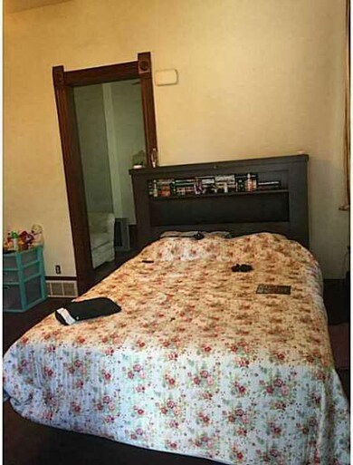 Bedroom. 1st floor apartment parlor which is being