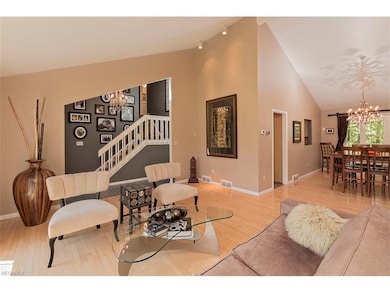 Bright and open living/dining space has cathedral 