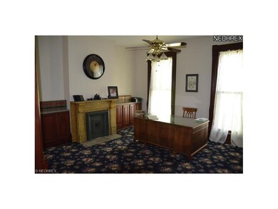 Living room with decorative fireplace.