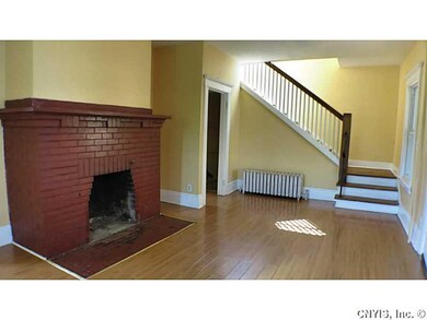 Living Room. Brick fireplace and hardwoods in the 