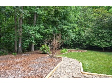 Back yard landscaping with newer stone and landsca