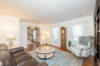 Living area featuring visible vents, wood finished